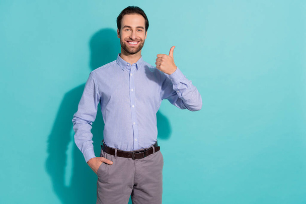 Photo of successful manager approve workplace option raise thumb up wear purple shirt isolated teal color background - Photo, Image