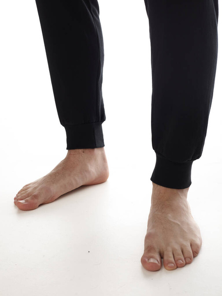 male feet barefoot on a white background - Фото, изображение