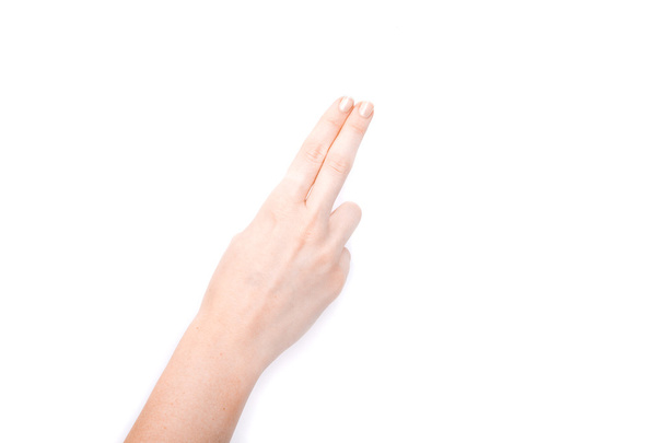Female hand showing gesture on an isolated white background - Foto, immagini