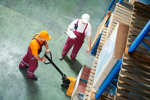worker with fork pallet truck - Photo, Image