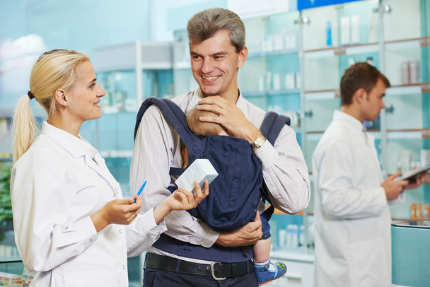 Pharmacy chemist, father and child in drugstore - Foto, imagen
