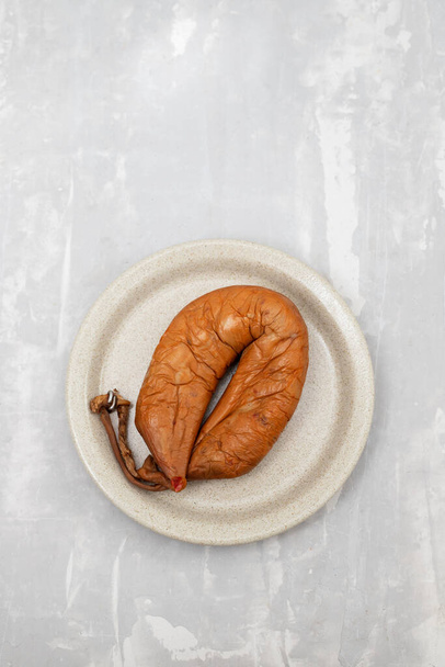 typical portuguese smoked sausage Farinheira on the dish on ceramic - Foto, afbeelding