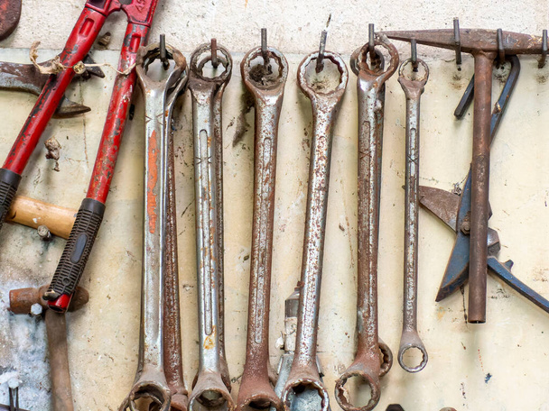 Lots of old rusty tools in an old garage  - Fotografie, Obrázek