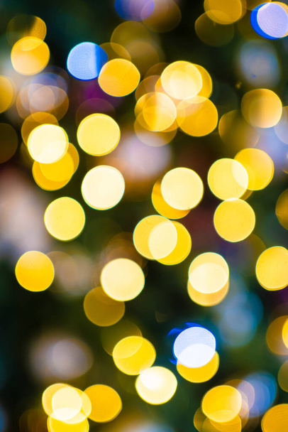 The light bulbs of the electric garland are defocused. - Photo, Image