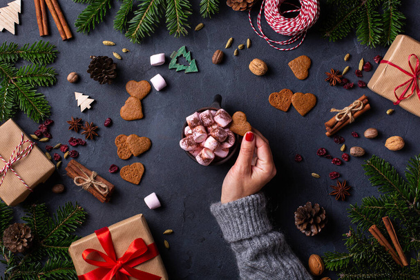 Christmas, female hands with gift boxes and cup of cocoa - Photo, Image