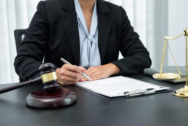 Female lawyer working with legal case document contract in office, law and justice, attorney, lawsuit concept. - 写真・画像