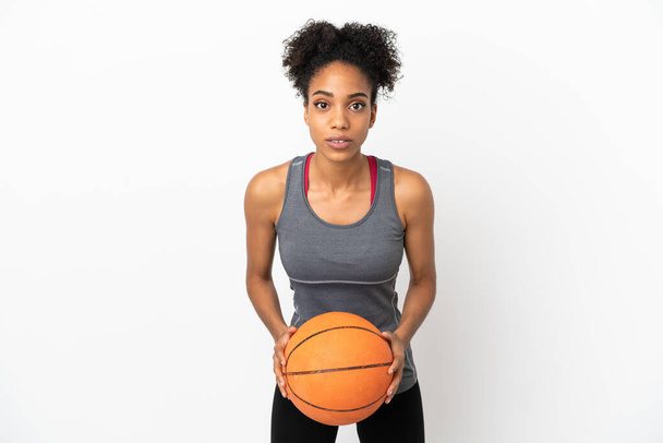 Young basketball player latin woman isolated on white background playing basketball - Φωτογραφία, εικόνα