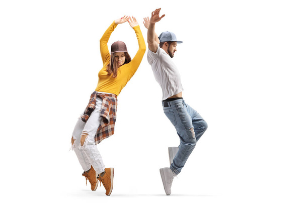 Full length profile shot of hip hop dancers performing a choreography isolated on white background - Photo, Image