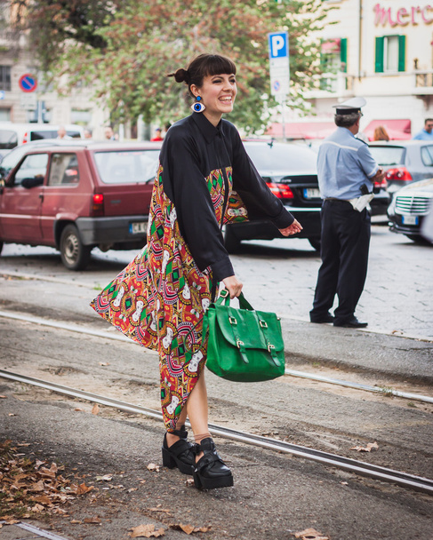 Woman posing outside Gucci fashion shows building for Milan Women's Fashion Week 2014 - 写真・画像