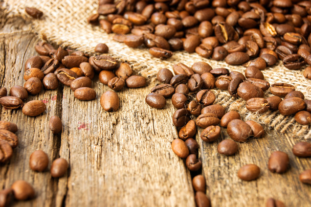 Coffee beans on wood background - Фото, изображение
