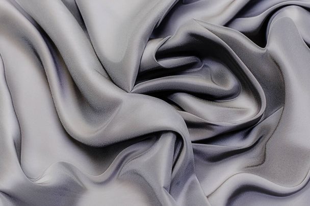 Close-up texture of natural gray or black fabric or cloth in same color. Fabric texture of natural cotton, silk or wool, or linen textile material. Black canvas background. - Photo, Image
