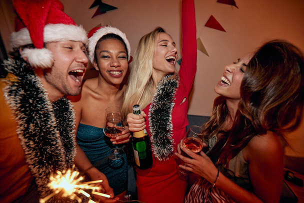 Happy people dancing and celebrating together  New Year's Eve - 写真・画像