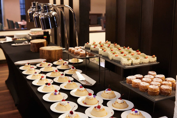 A buffet with desserts in the restaurant - Foto, immagini