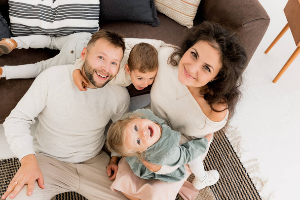 happy young  family having fun on the floor  at home  - Фото, зображення