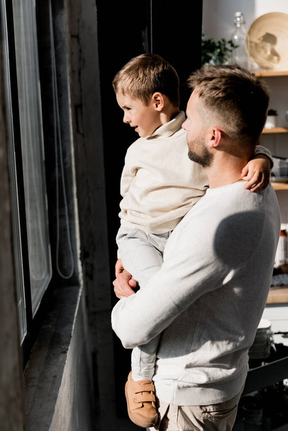 young father with boy at home by window - Zdjęcie, obraz
