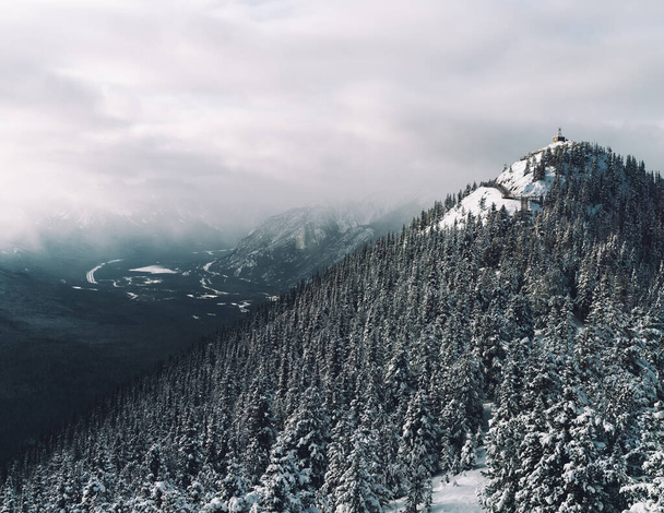 A beautiful landscape of hills covered in snow - Photo, Image