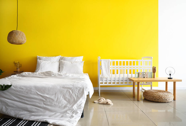 Interior of bright bedroom with white crib - Photo, Image