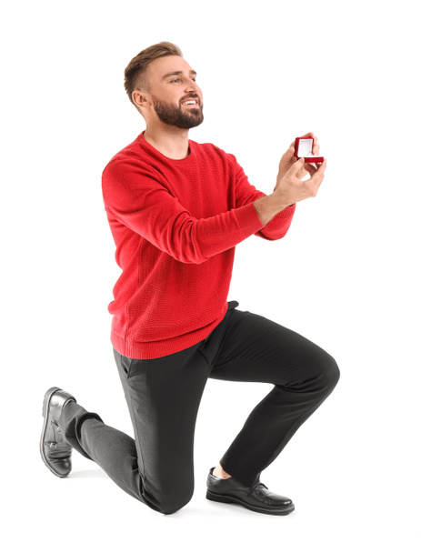 Proposing young man on white background - Photo, image