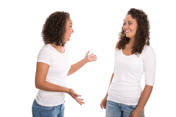 Real twins talking together: isolated over white background - Foto, immagini