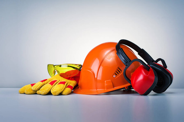 Personal Protective Equipment On Grey Background. Work Safety Concept. - Foto, Imagem