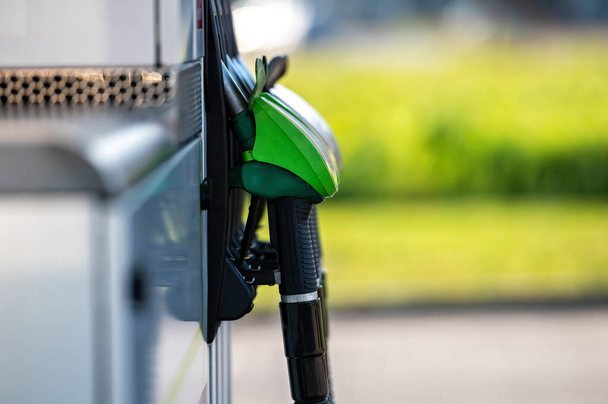 row with green and black refueling guns at the gas station, closeup, horizontal shot - Photo, image