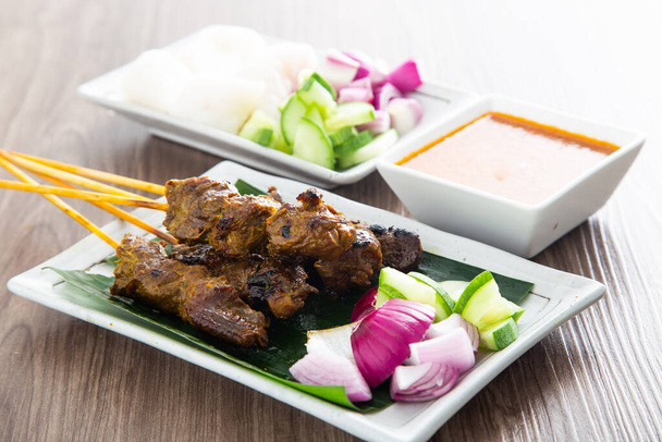 Malaysian mutton satay with delicious peanut sauce. famous food in Southeast Asia. - Photo, Image