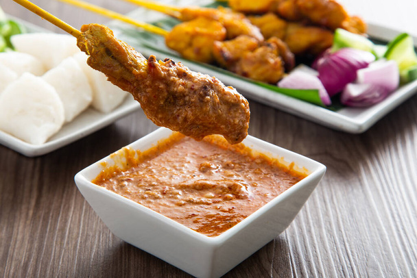 Malaysian satay with delicious peanut sauce. famous food in Southeast Asia. - Photo, Image