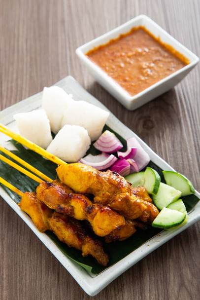 Malaysian chicken satay with delicious peanut sauce. famous food in Southeast Asia. - Photo, Image