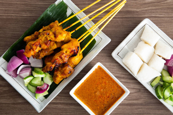 Malaysian chicken satay with delicious peanut sauce. famous food in Southeast Asia. - Photo, Image