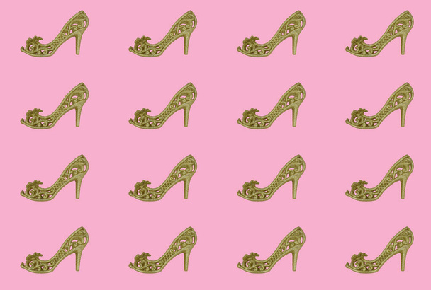 Sexual gold shoes on a high heel pattern background - Photo, Image