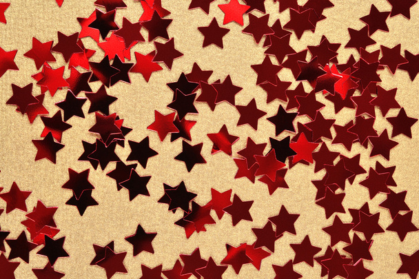 Конфетти в форме красных звёзд
 - Фото, изображение