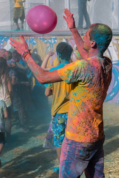 a crowd of people dancing on a colorful festival of colors - Photo, Image