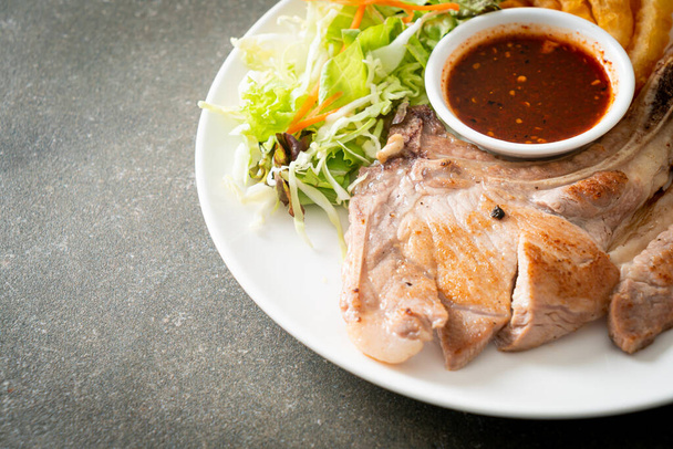 grilled pork chop steak with Thai spicy dipping sauce or Jaew sauce - fusion food style - Φωτογραφία, εικόνα