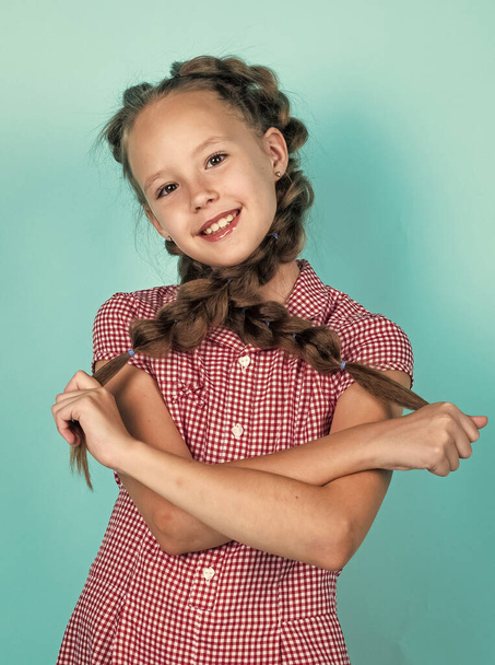happy teen girl with braided hair in pigtails, childhood - 写真・画像