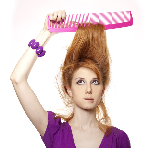 Funny red-haired girl with big comb. - Photo, Image