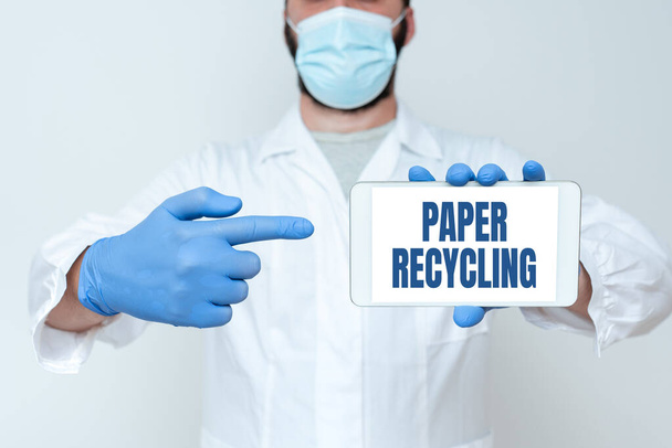Conceptual caption Paper Recycling. Word Written on Using the waste papers in a new way by recycling them Research Scientist Presenting New Smartphone, Upgrading Old Technology - Photo, Image