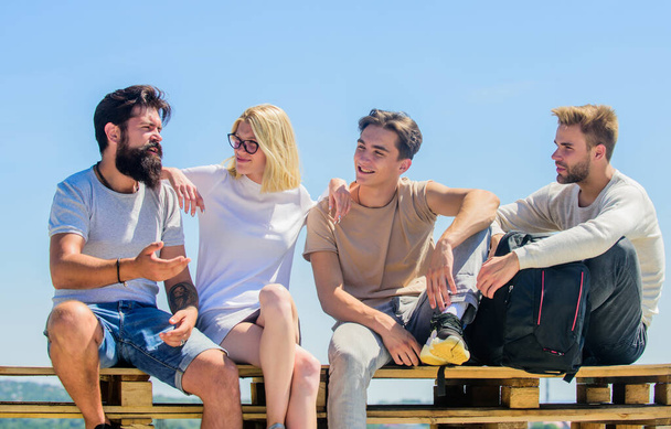 Best weekend ever. group of four people. great fit for day off. Group of people in casual wear. happy men and girl relax. best friends. Summer vacation. diverse young people talking together - Foto, Imagen