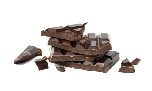 broken black chocolate with pieces isolated on white background. Dessert bar of chocolate, close up - Photo, Image