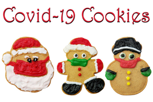 Coronavirus Christmas Cookies. Gingerbread Santa Claus. Gingerbread Man. Gingerbread Snowman wearing a face mask. Isolated on white. Room for text. Covid-19 Cookies. Christmas Cookies. Home Made Gingerbread Christmas Cookies. Merry Christmas.  - Photo, Image