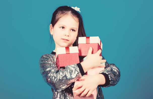 Shopping day. Child carry lot gift boxes. Kids fashion. Surprise gift box. Birthday wish list. Special happens every day. Shop for what you want. Girl with gift boxes blue background. Black friday - Φωτογραφία, εικόνα