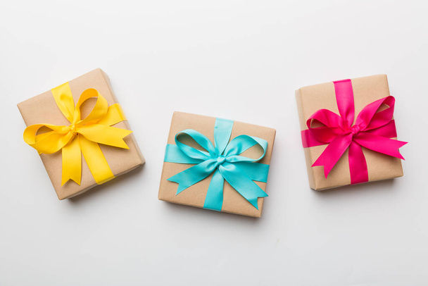 Holiday present box over colored background, top view. - Foto, imagen