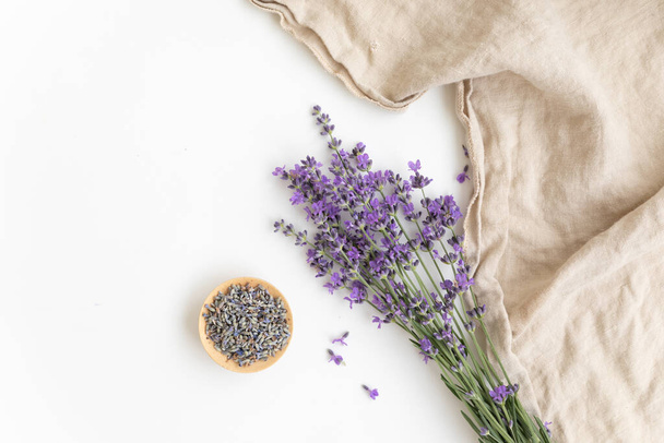 Lavender flowers. Flat lay concept skin care. Light background with lavend. - Fotó, kép
