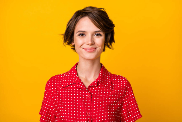 Photo of young pretty charming happy smiling cheerful girl in red dotted shirt isolated on yellow color background - Φωτογραφία, εικόνα