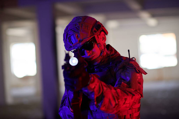 modern warfare soldier in urban environment battlefield aiming on weapons and scanning for target - 写真・画像