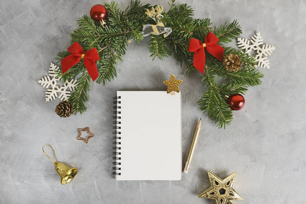 Top view flat lay christmas mockup with stack of notebooks and pencil. Wish list, holidays concept. Text space - Zdjęcie, obraz