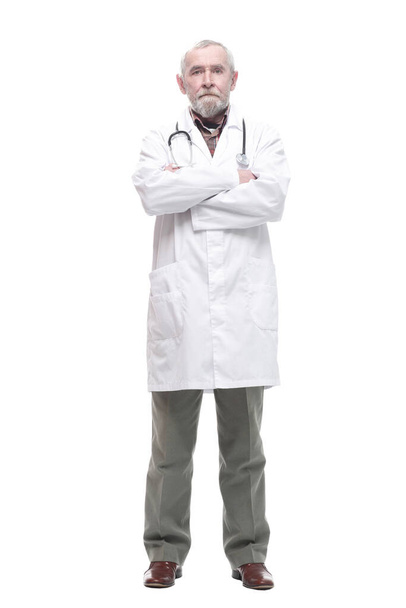 elderly competent doctor with a stethoscope. isolated on a white - Фото, изображение