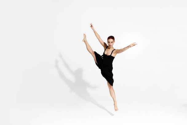 Female caucasian ballet dancer isolated in studio - Fotó, kép
