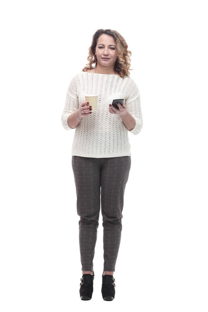 young woman with a smartphone and a takeaway coffee. - Zdjęcie, obraz