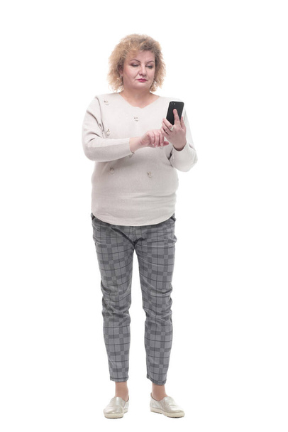 attractive adult woman with a smartphone. isolated on a white - Foto, Bild