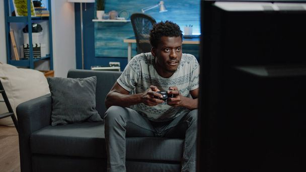 African american man losing at video games on console - Fotoğraf, Görsel